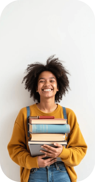 Student holding books smiling